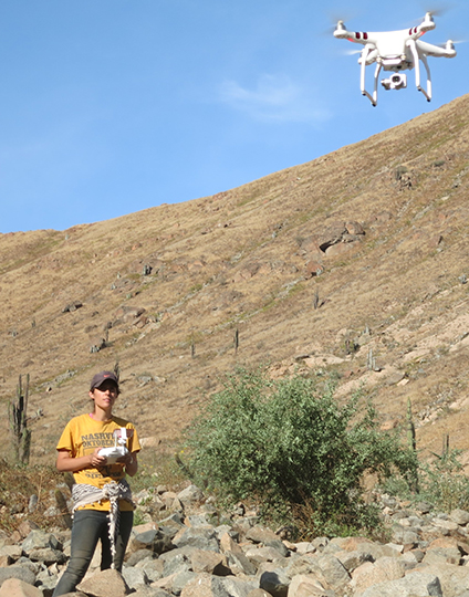 Kasia Szremski flying a drone at a dig site in Peru