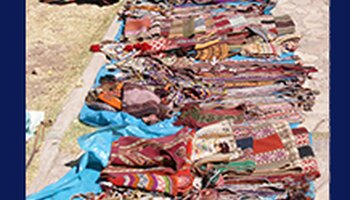 Quechua Indian woman selling blankets
