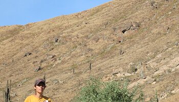 Kasia Szremski flying a drone at a dig site in Peru