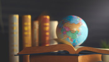 globe sits atop books