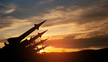 missiles aimed to the sky at sunset