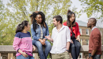A group of Illinois students talking
