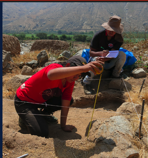 photo showing two student archeologists from Peru fieldwork